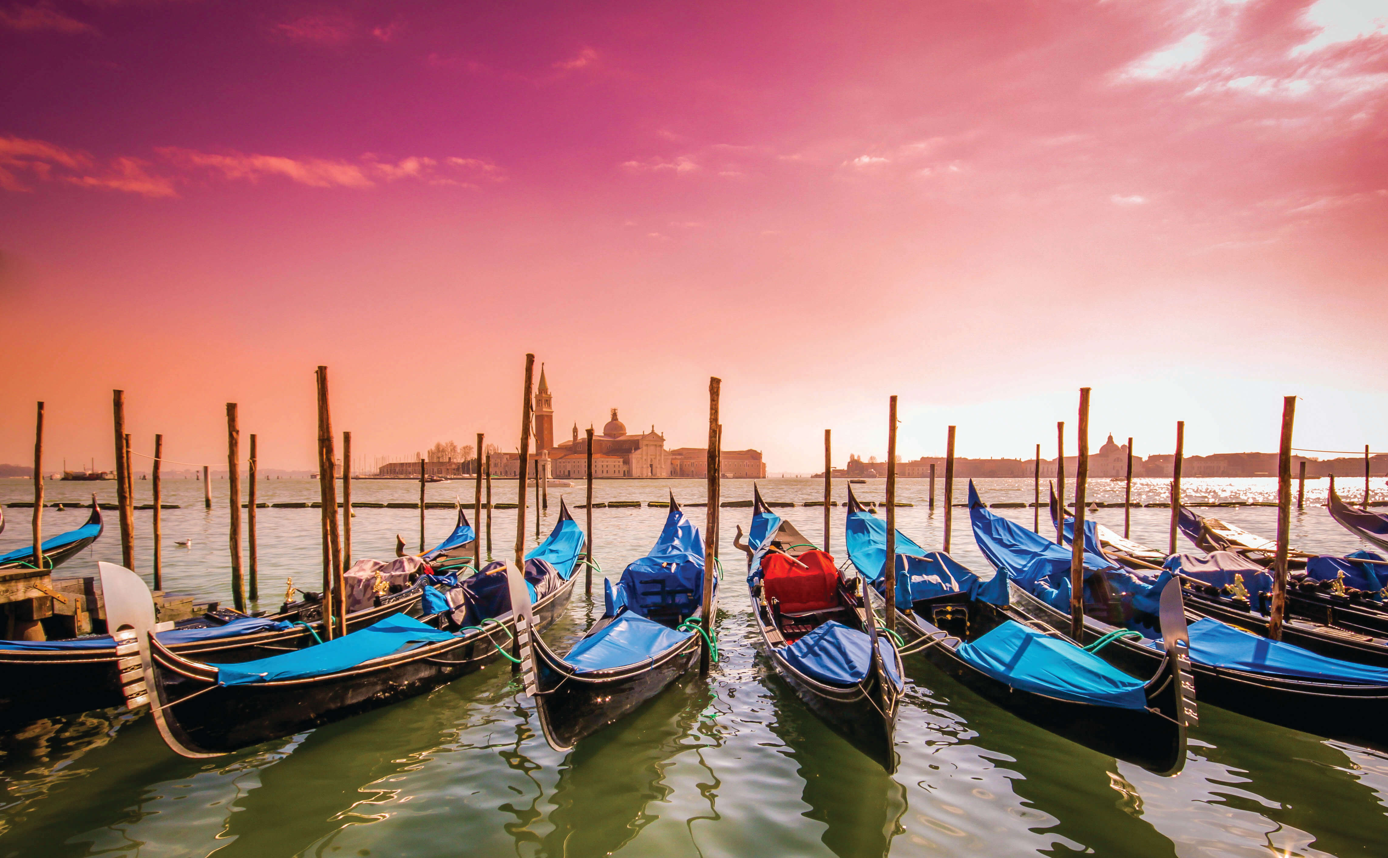Gondolas after sunset in Venice