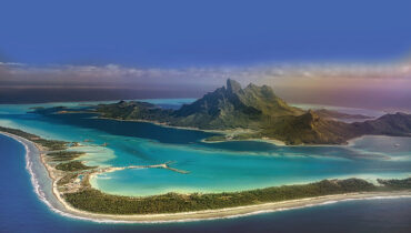 View of Bora Bora island from airplane window during landing